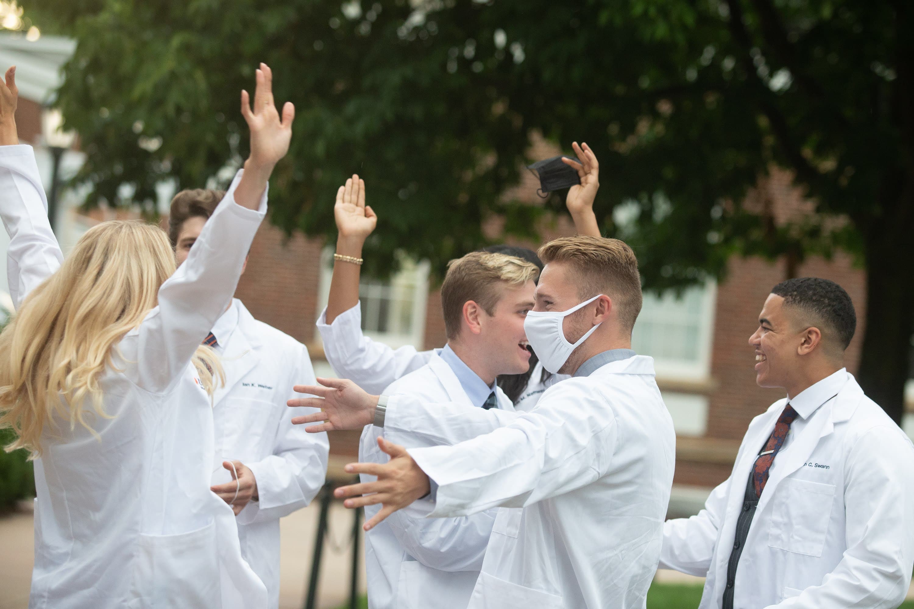 Students celebrating medical school success